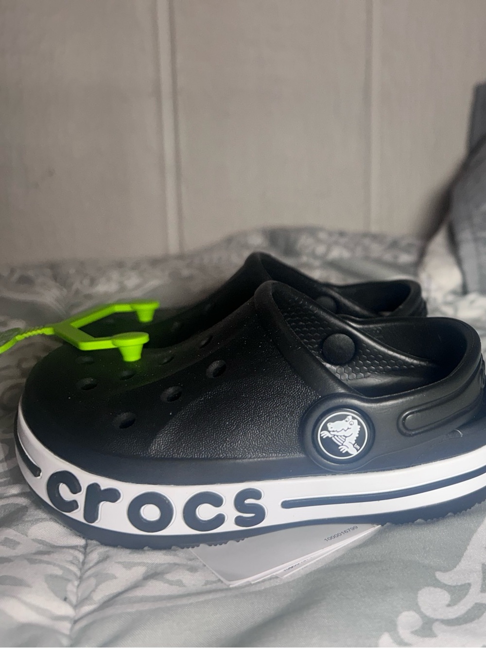 CROCS Kids Black Clog with White Trim and Neon Green Charm